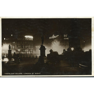 Real Photograph Postcard  'Trafalgar Square. London by Night'